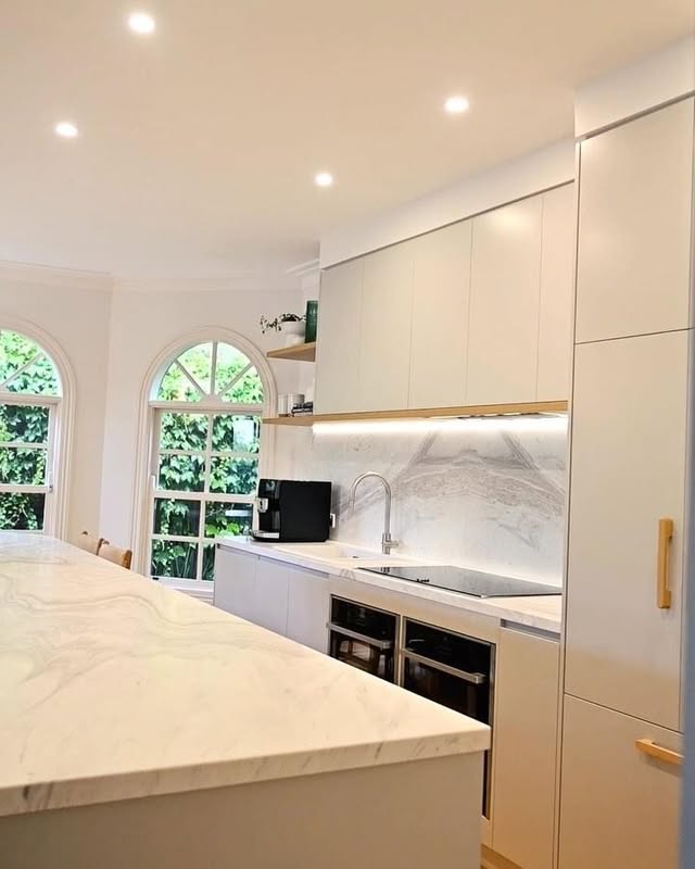 White marble waterfall island kitchen